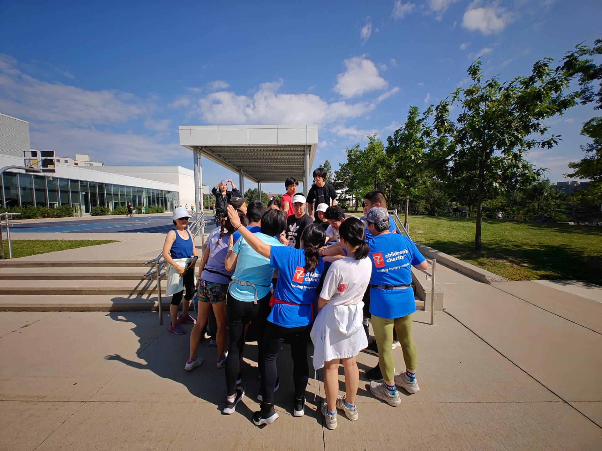 Team huddle outside the community centre before a run